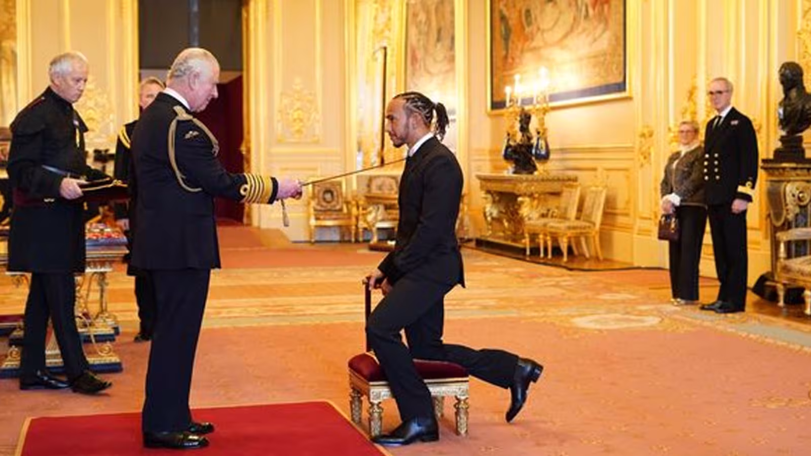 Lewis Hamilton knighted by Prince of Wales at Windsor Castle just days after F1 heartache